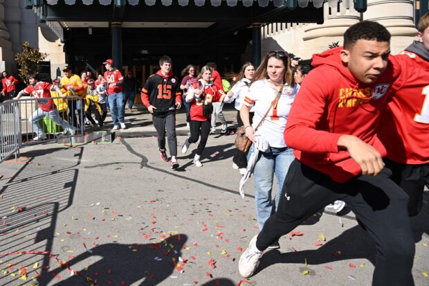 People flee after shots were fired near the Kansas City Chiefs' Super Bowl LVIII victory parade on February 14, 2024, in Kansas City, Missouri. A shooting incident at a packed parade Wednesday to cele