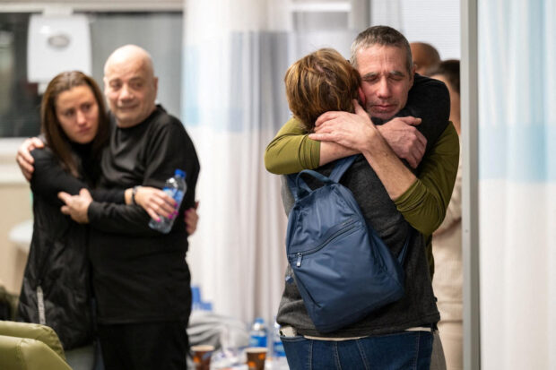 Fernando Simon Marman and Louis Hare reunite with loved ones at the Sheba Medical Center, in Ramat Gan