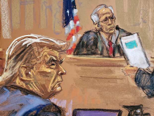 President Donald Trump and Justice Arthur Engoron of the state Supreme Court listen to opening arguments from his lawyer Alina Habba (not seen), during the trial of Trump, his adult sons, the Trump Organization and others in a civil fraud case brought by state Attorney General Letitia James, at a 