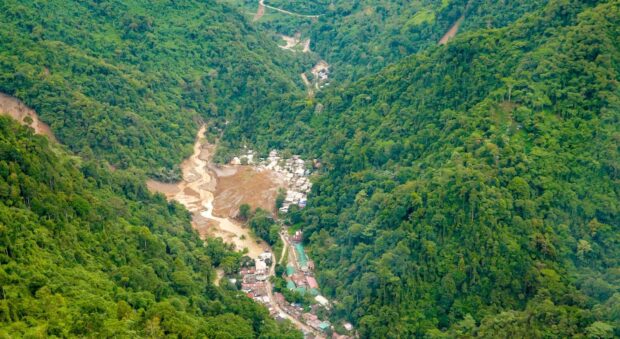 PHOTO: Aerial shot of the landslide site in Maco, Davao de Oro. STORY: Davao de Oro landslide: Number of bodies recovered climb to 90
