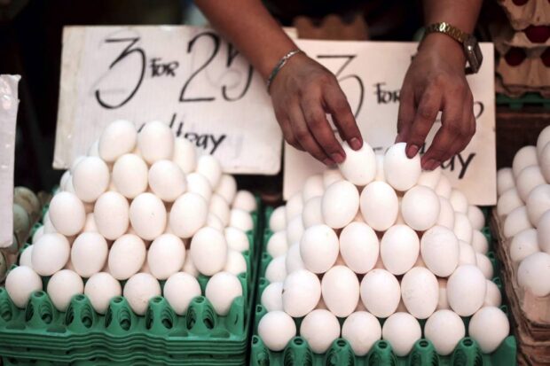 A vendor arranges eggs being sold for 250-275 per tray at Marikina City Public Market on Thursday, February 16, 2023. 
