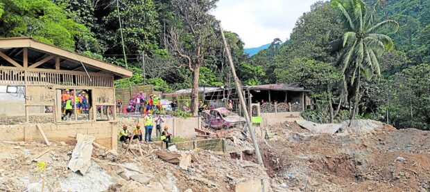 PHOTO: Responders, backed by heavy equipment, comb “ground zero” of a massive landslide in Masara village on Saturday, Feb. 10, 2024. STORY: Search for Davao de Oro landslide survivors ends; death toll at 71