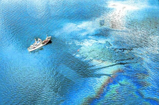 PHOTO: Photo taken during an aerial inspection conducted by President Ferdinand Marcos Jr. and the Philippine Coast Guard on April 15, 2023, shows the coastal waters of Oriental Mindoro province still bearing traces of the Feb. 28, 2023 oil spill from the sunken MT Princess Empress. STORY: DOJ endorses raps over Mindoro oil spill
