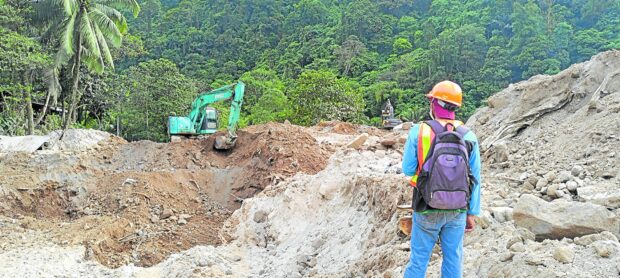 Responders, backed by heavy equipment, comb the ground zero of a massive landslide in the village of Masara in Maco, Davao de Oro, in this photo on Feb. 10, four days after thetragedy struck. The landslide killed nearly 100 people with more than 30 others still missing. 