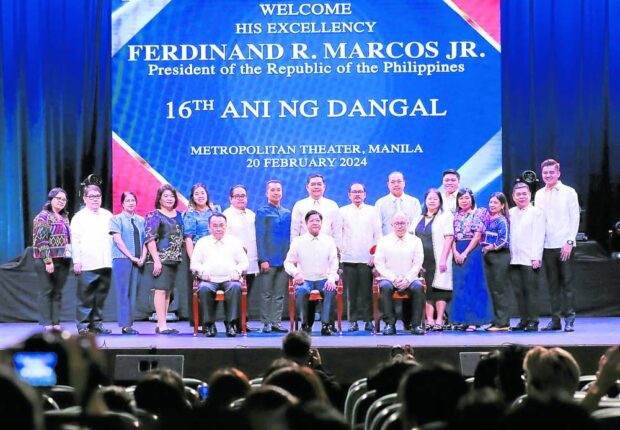‘GET IT DONE’ President Marcos (center, seated) leads the awards ceremony for this year’s Ani ng Dangal honorees at the Metropolitan Theater in Manila on Tuesday, where he also spoke to reporters on how he wishes the Charter change process to go. —MALACAÑANG PHOTO