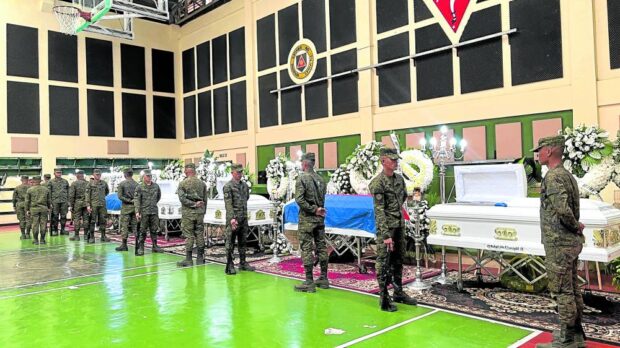 ** for t0221min1 ** FEBRUARY 20, 2024Honor guards stand beside the coffin of six soldiers slain in Sunday’s battle with Islamic State-linked terrorists in Munai, Lanao del Norte. Photos by Leah D. Agonoy