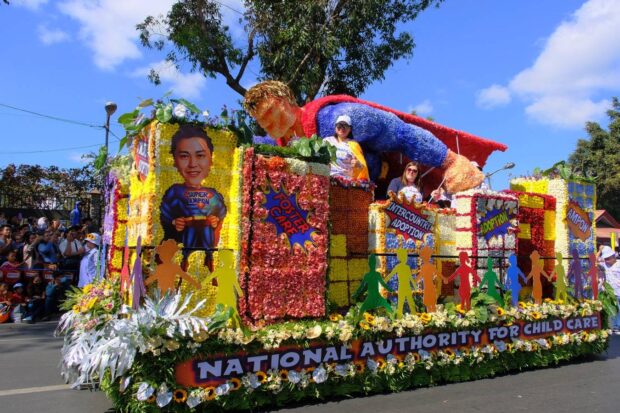 PHOTO: To dramatize the importance of adoptive parents and foster parents, the National Commission on Child Care selected superheroes as the theme for its floral float in the 2024 Baguio Flower Festival Grand Float Parade held on Sunday, Feb. 25, 2024. STORY: Panagbenga float parade becomes platform for social advocacy