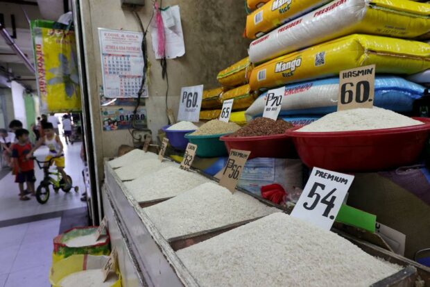 STILL THE SAME / FEBRUARY 15, 2024 Rice prices are displayed at a rice retail store in Marikina Public Market in Marikina City on Thursday, February 15, 2024. Farmers group Samahang Industriya ng Agrikultura (SINAG) said according to their monitoring effort prices of rice in some public markets in the city have gone down. INQUIRER PHOTO / GRIG C. MONTEGRANDE 
