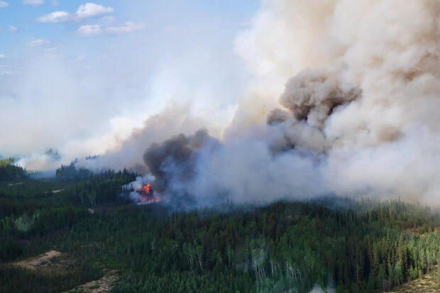 FILE PHOTO: The Paskwa fire (HWF030) burns near Fox Lake