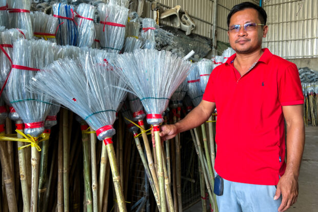 Cambodia 'upcycler' turns tonnes of plastic bottles into brooms