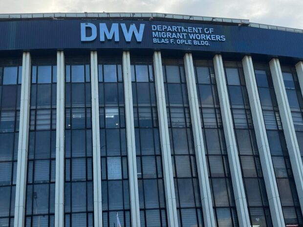 PHOTO: Facade of the Department of Migrant Workers (DMW) building STORY: DMW: Illegal recruiter promising jobs abroad arrested