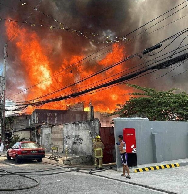 PHOTO: A fire hits a residential area in Barangay Tatalon in Quezon City on Tuesday, February 27, 2024, according to the Bureau of Fire Protection. STORY: BFP: Fire hits Barangay Tatalon in Quezon City