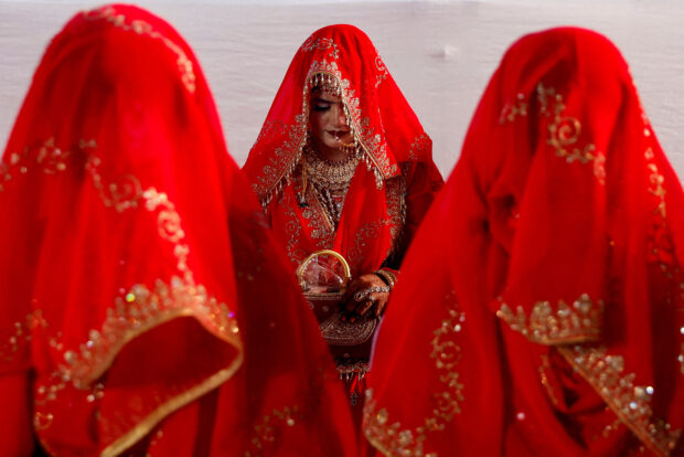 Muslim women are seen during a mass marriage ceremony, in which, 51 Muslim couples took their wedding vows, in Mumbai