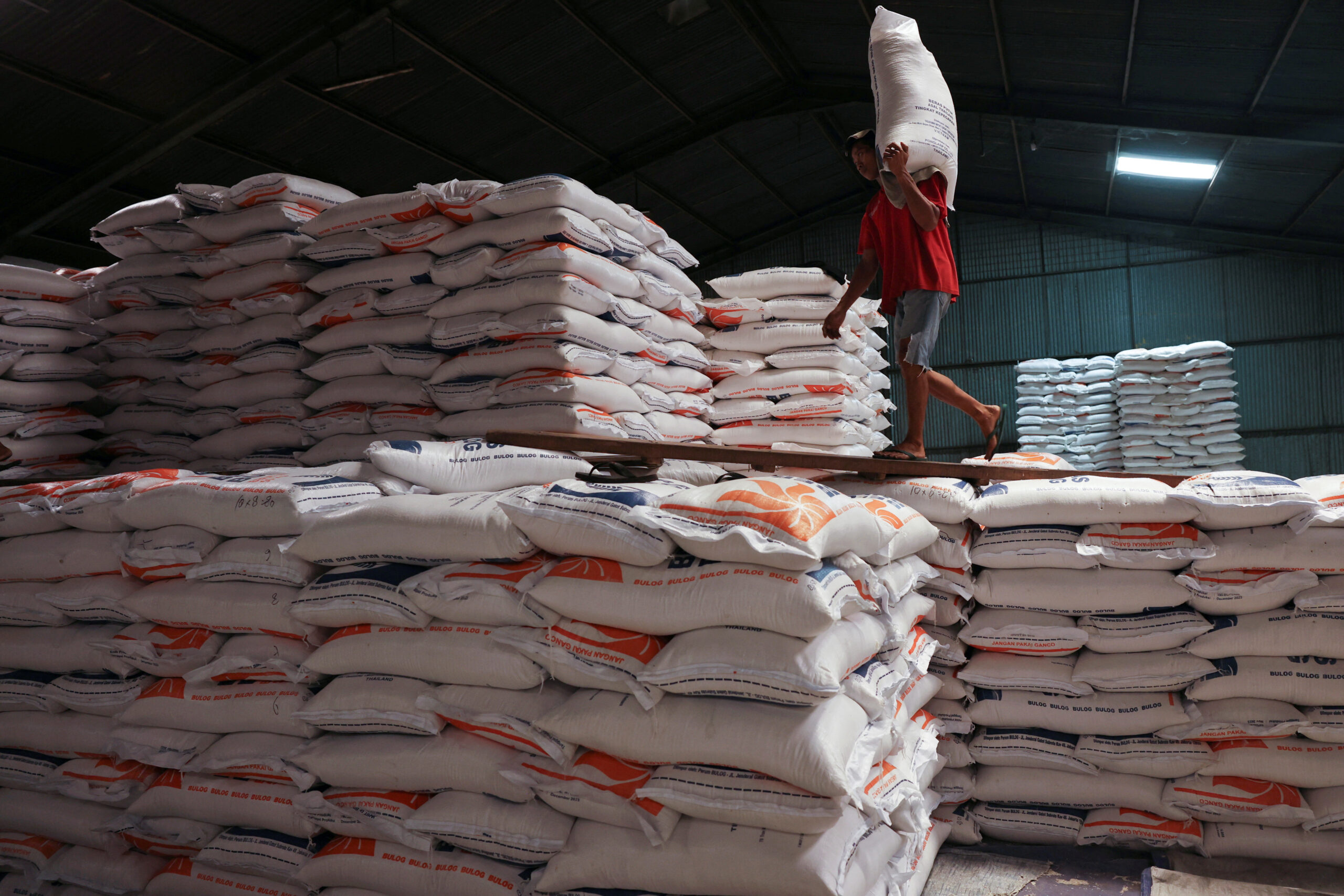 Long lines for subsidized rice highlight plight of Indonesia's poor