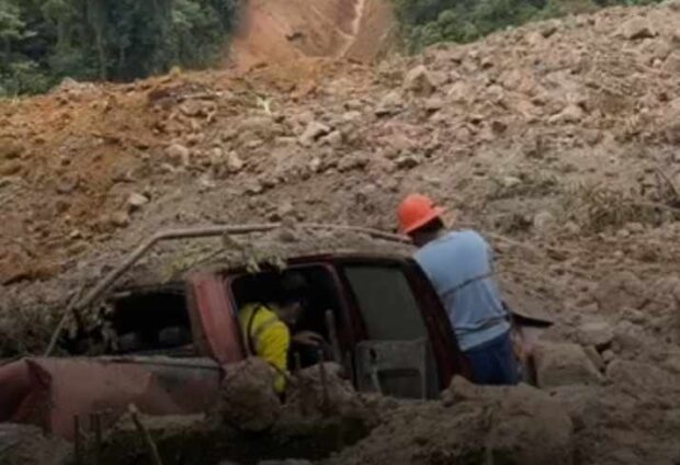 PHOTO: Rescuers unearth a vehicle among the mud and rocks dumped on the village of Masara in Maco, Davao de Oro. STORY: 45 mine workers rescued from Davao Oro landslide; 41 still missing