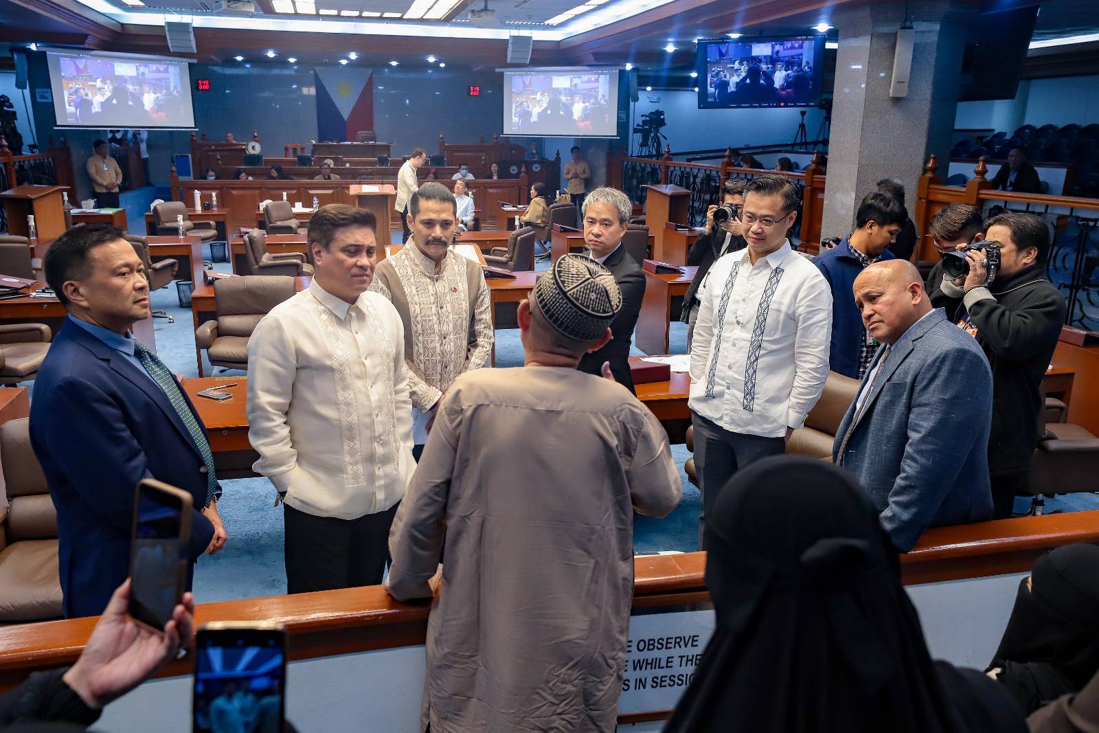 SENATORS LISTEN TO SUSPECT IN MISTAKEN IDENTITY: (From left) Sen. Joseph Victor “JV” Ejercito, Senate President Juan Miguel “Migz” F. Zubiri, Sen. Robin Padilla, Majority Leader Joel Villanueva, Sen. Win Gatchalian and Sen. Ronald “Bato” Dela Rosa listen attentively to Mohammad Maca-anta Said during plenary session break Wednesday, February 7, 2024 as he related how he was arrested by National Bureau of Investigation (NBI) agents at the Ninoy Aquino International Airport (NAIA) on August 29, 2023 when he was about to leave for Kuala Lumpur, Malaysia after he was mistakenly identified as an Abu-Sayyaf member who was in the Interpol wanted list for kidnapping and homicide. Said was released through the efforts of the Senate to clear his name. (Bibo Nueva España/Senate PRIB)