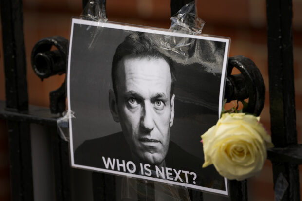 A flower and a picture are left as a tribute to Russian politician Alexei Navalny