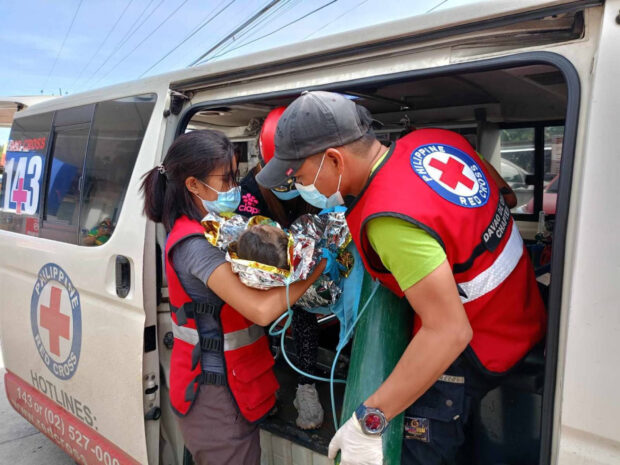 A Philippine Red Cross (PRC) teamattendsto the 3-year-old girl who was pulled alive from under tons of mud and debris on Friday, three days after the Feb. 6 landslide that hit the mining village of Masara in Maco, Davao de Oro.