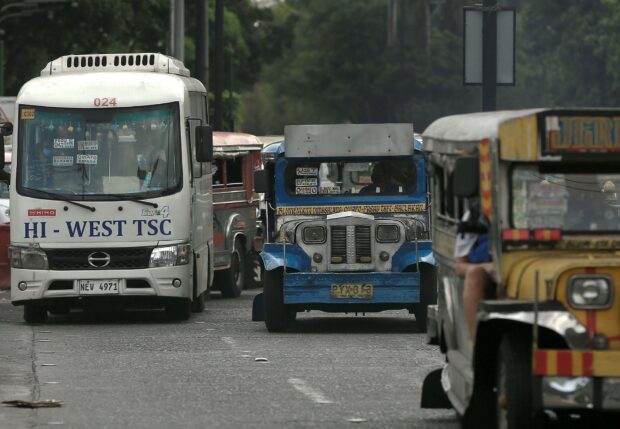 Jeepneys ply Padre Burgos Avenuein Manila, mostly under a problematic franchise system