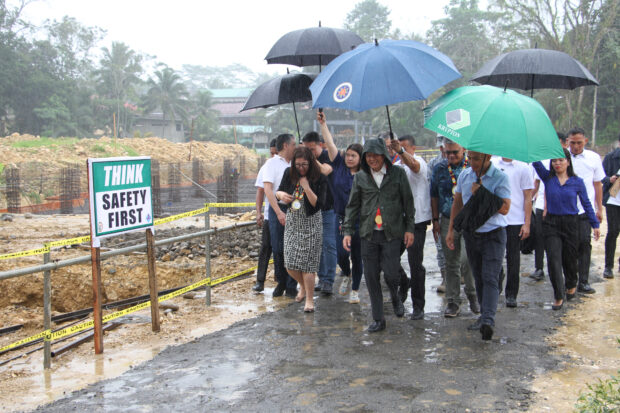 President Marcos and Australian Ambassador to the Philippines Hae Kyong Yu brave the rains to make a site visit to the state-of-the-art soils lab in Agusan del Sur. Photo courtesy of Provincial Public Information Office in Agusan del Sur.