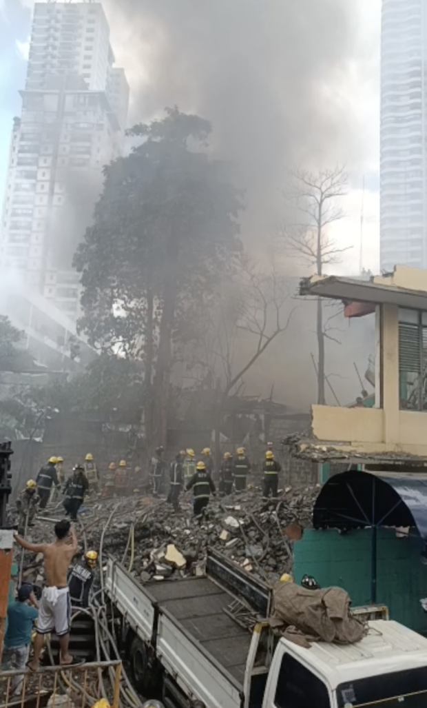 PHOTO: Firefighters continue to extinguish a fire which broke out in Sta. Cruz Manila on Wednesday. STORY: Fire hits residential area in Santa Cruz, Manila