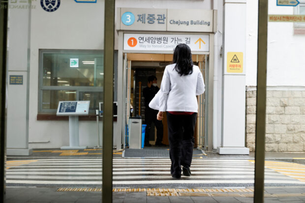A medical worker walks at Severance Hospital in Seoul