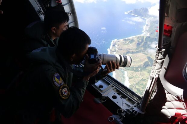 Philippine Air Force personnel aboard transport aircraft C-295 observes during the air patrol on the towns of Itbayat, Sabtang in Batanes and Babuyan Islands on Saturday, Feb 26. PHOTO FROM THE PHILIPPINE AIR FORCE