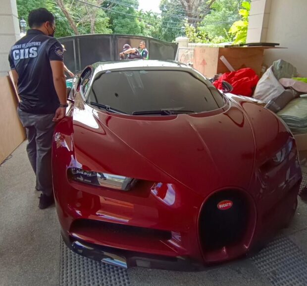 PHOTO: A red Bugatti Chiron sports car worth P165 million surrendered by the owner to the Bureau of Customs on Friday, Feb. 9, 2024. STORY: 