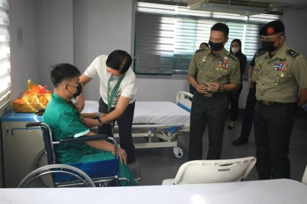 PHOTO: President Ferdinand Marcos Jr. awards injured soldiers with medals at the Army General Hospital in Fort Bonifacio, Taguig City on Monday, February 12, 2024. STORY: Marcos honors 4 soldiers wounded in clash with terrorists