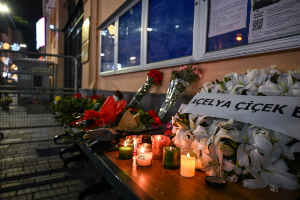 Flowers have been laid and candles lit at a makeshift memorial outside the Russian consulate in Istanbul on March 23, 2024, a day after a deadly attack by gunmen on a Moscow concert hall killed more than 130 people and wounded dozens more. Four gunmen stormed the Crocus City venue before the start of a rock concert on March 22, opened fire on the audience and set fire to the building, in an assault claimed by the Islamic State group. 