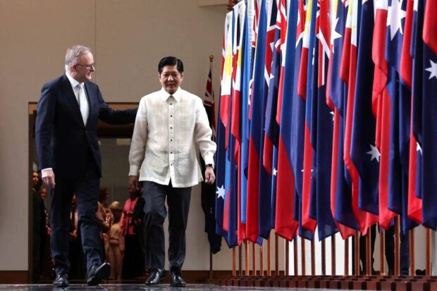 PHOTO: Australian Prime Minister Anthony Albanese (left) walks with President Marcos STORY: