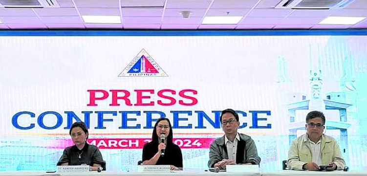 Quezon City Mayor Joy Belmonte (middle)updates journalists on the pertussis outbreak in her city.