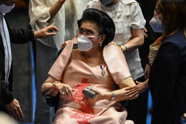PHOTO: Imelda Marcos on a wheelchair. STORY: Imelda Marcos being treated for pneumonia