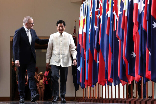 Australian Prime Minister Anthony Albanese (left) walks with President Marcos