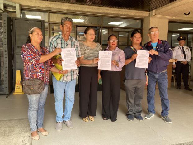 Progressive groups from Cavite join Gabriela party-list Rep. Arlene Brosas in filing a House resolution that seeks to probe a series of fires in coastal communities in the province on March 18, 2024. (From left to right: Mimi Doringo of Kalipunan ng Damayang Mahihirap (Kadamay), Martin Peñacosa of Kadamay-Cavite, Rep. Arlene Brosas of Gabriela Women’s Party, Nieve Numeron of Kadamay-Cavite, Aries Solenad of Pamalakaya, and Salvador France of Pamalakaya.) Photo from Pamalakaya.Progressive groups from Cavite join Gabriela party-list Rep. Arlene Brosas in filing a House resolution that seeks to probe a series of fires in coastal communities in the province on March 18, 2024. (From left to right: Mimi Doringo of Kalipunan ng Damayang Mahihirap (Kadamay), Martin Peñacosa of Kadamay-Cavite, Rep. Arlene Brosas of Gabriela Women’s Party, Nieve Numeron of Kadamay-Cavite, Aries Solenad of Pamalakaya, and Salvador France of Pamalakaya.) Photo from Pamalakaya.