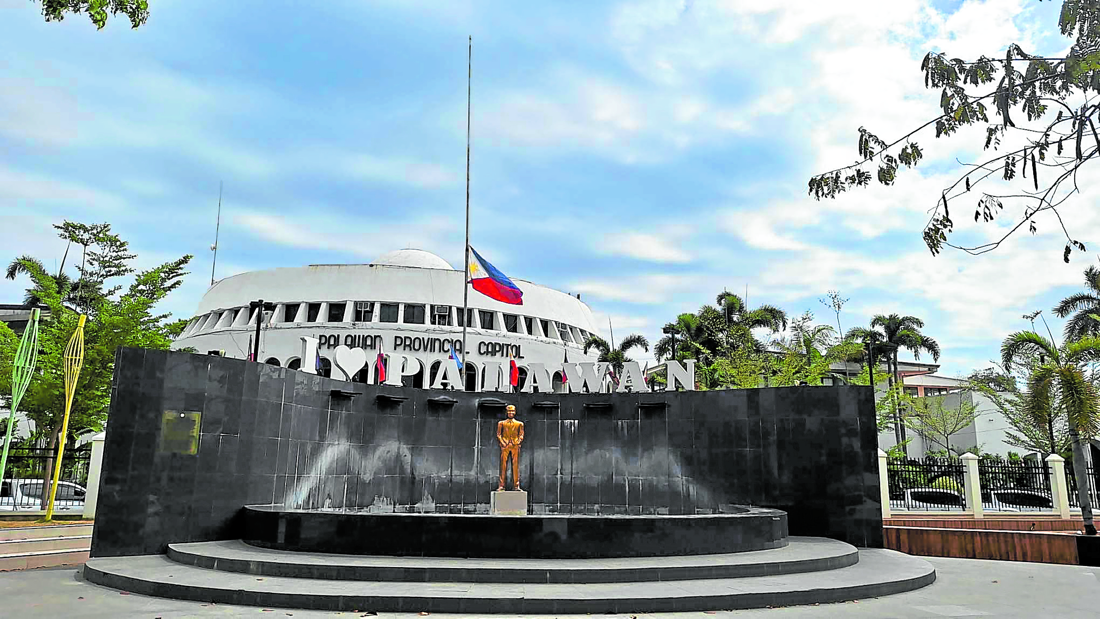 Philippine flag at the Palawan capitol is raised at half-staff 