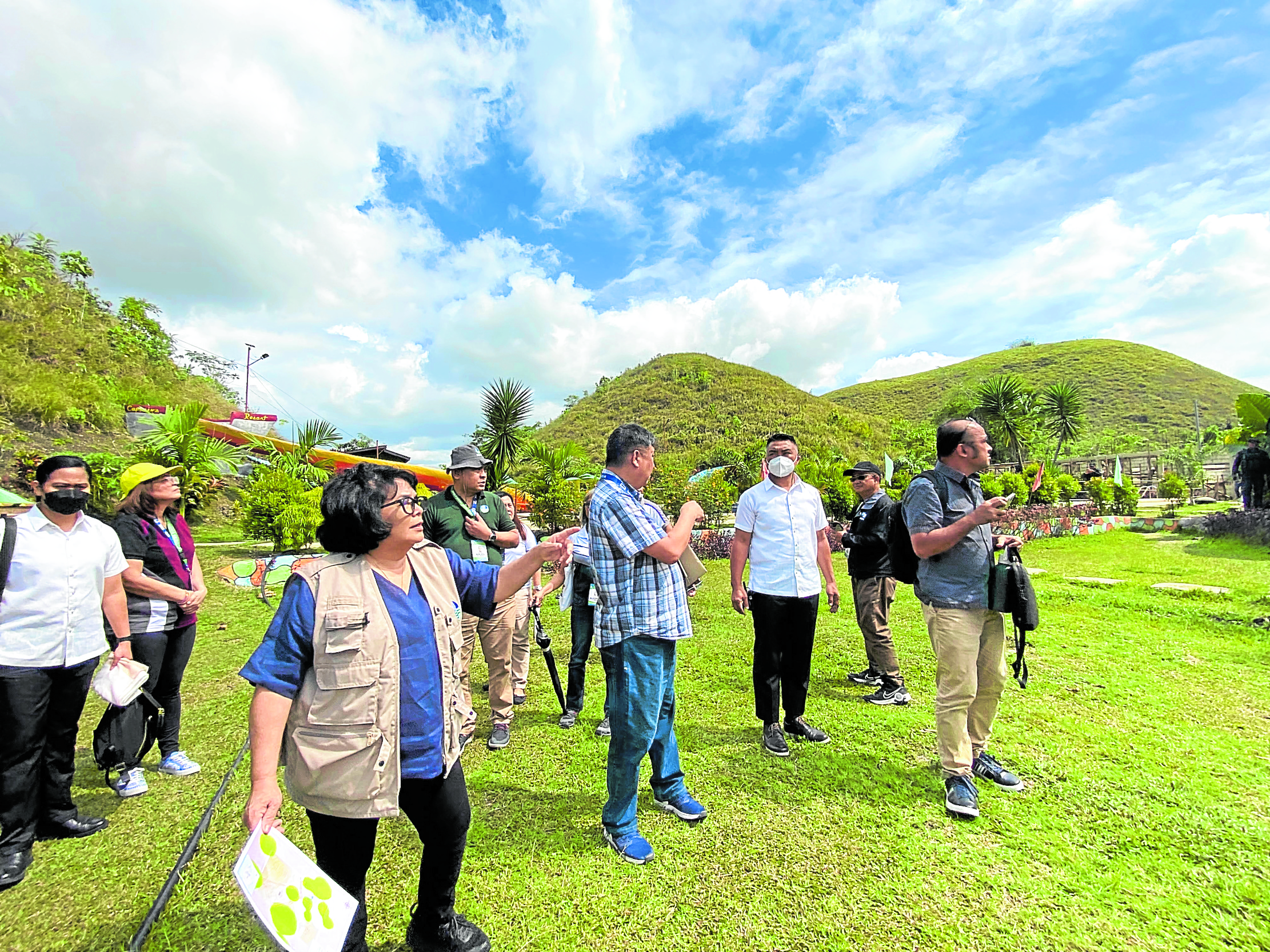Environment Secretary Maria Antonia Yulo Loyzaga (third from left) leads a government teamin inspecting the Captain’s Peak Garden and Resort in Sagbayan, Bohol, on Thursday.The visit was part of the Department of Environment and Natural Resources’ investigation into the illegal structures within the Chocolate Hills.
