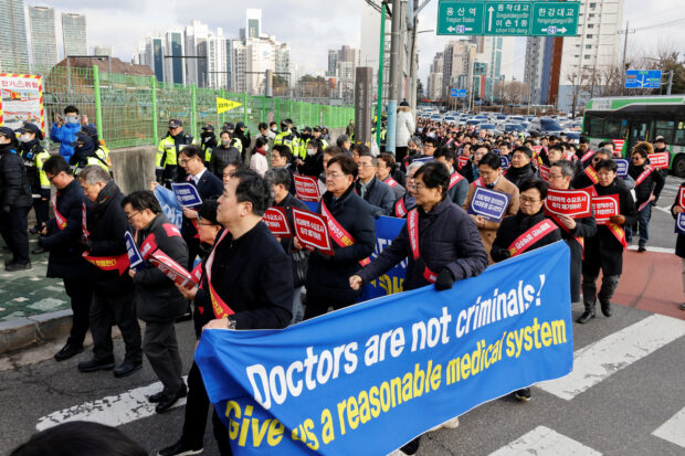 South Korean doctors march to protest against the government medical policy in Seoul