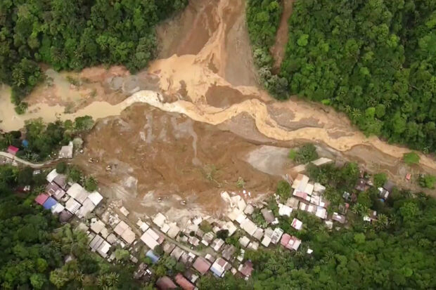 PHOTO: This screengrab from AFPTV aerial video footage taken on February 7, 2024 shows the site of a landslide in Davao de Oro province on Mindanao island in the southern Philippines. Faulty warning systems, poverty and deforestation of mountains in the southern Philippines turned recent unseasonally heavy rains into deadly disasters, weather experts said in a report on March 1, 2024. STORY: Rainfall alone didn’t cause landslides, flooding in Mindanao