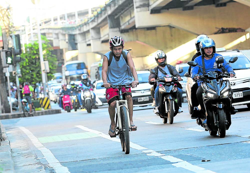 BYE-BYE, BIKE LANES? This bike lane in the Edsa-Kamuning area may soon give way to an exclusive motorcycle lane. The Metropolitan Manila Development Authority, along with the Department of Transportation, is considering reviving motorcycle lanes on Edsa, saying that only 1,500 cyclists use the dedicated bike daily compared to 170,000 motorcyclists who pass through Metro Manila’s busiest thoroughfare every day. —NIÑO JESUS ORBETA