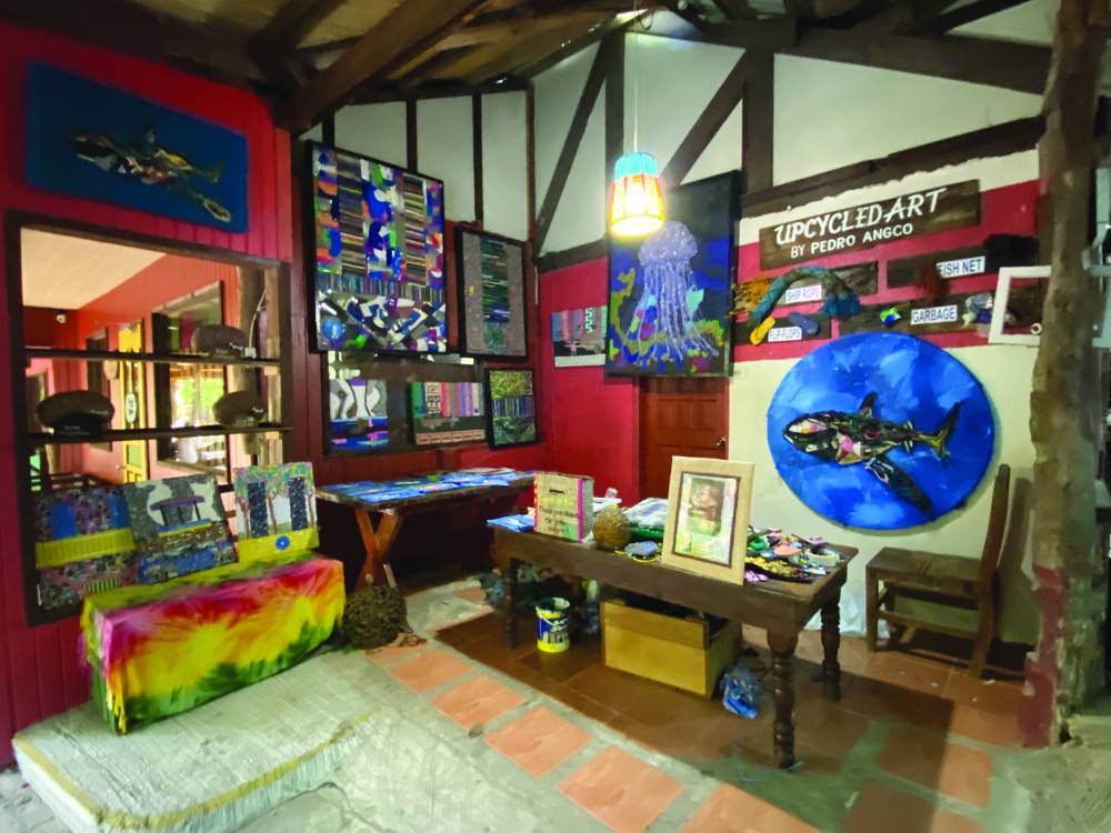 His art pieces made from trash, featuring marine creatures and undersea landscape, have beengiven space at Bohol Bee Farm so tourists can learn about how garbage impacts on the environment.
