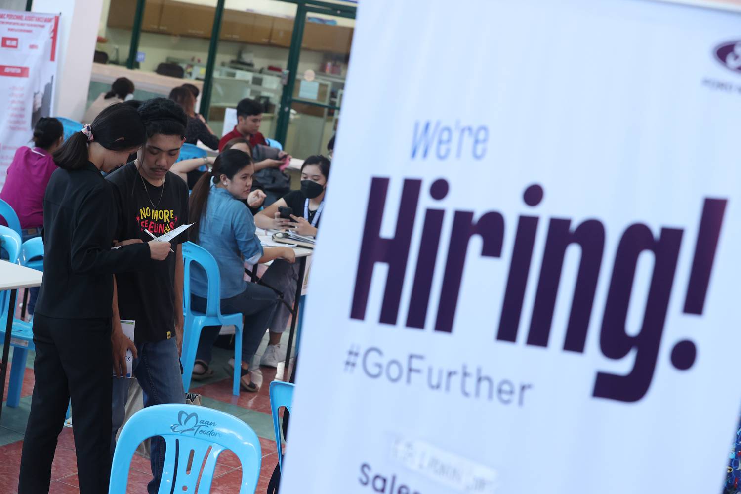 JOBHUNT Jobseekers look for potential employers during a job fair held at the Marikina City Hall on Saturday. Twenty-eight privatecompanies participated in the event organized by the city government ahead of Labor Day on May 1. 