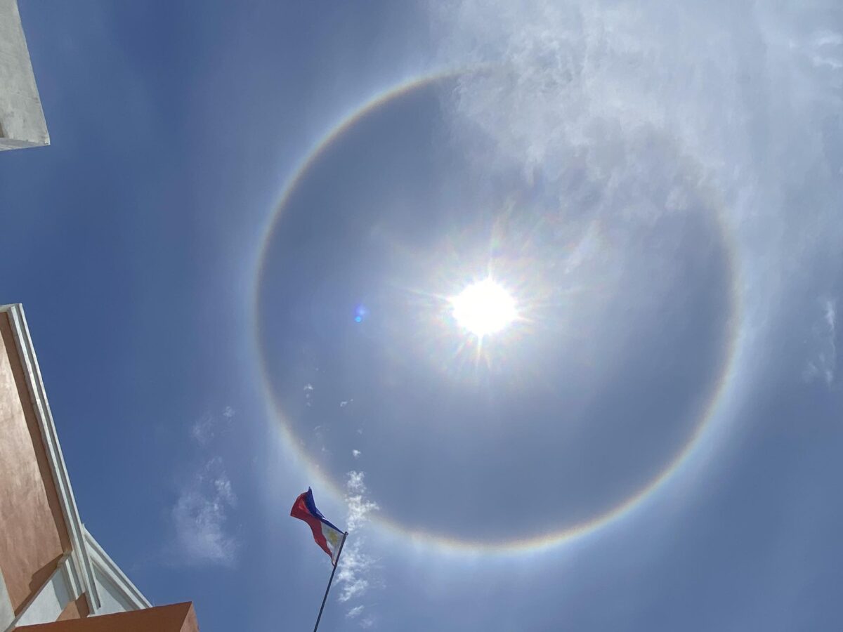 A sun halo, which is called "mariyes" in Batanes, appears in the skyline of Itbayat town on Tuesday (April 2).