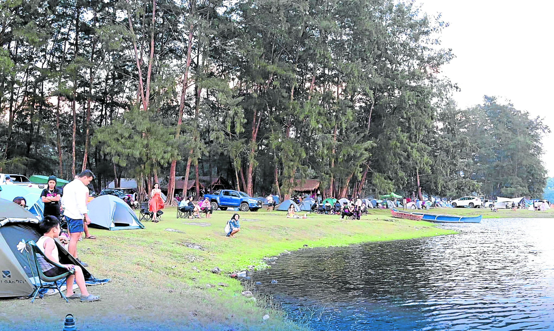 Tourists pitch tents around Mapanuepe Lake in San Marcelino, Zambales