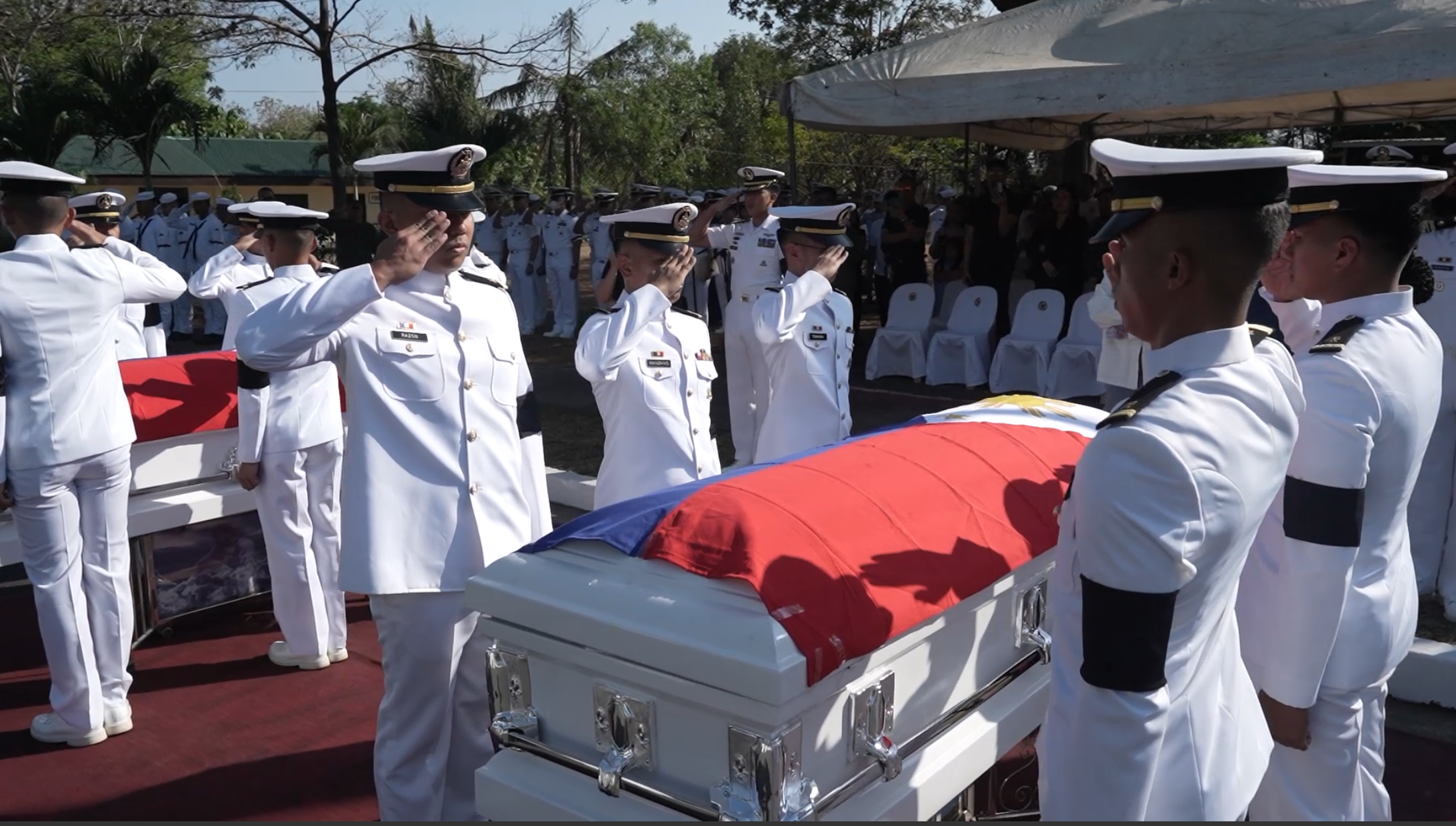 The Philippine Navy renders arrival honors to its two pilots who tragically lost their lives in a helicopter crash, before they are laid to rest at the Libingan ng mga Bayani in Taguig City. (Screengrab from Naval Public Affairs Office video)