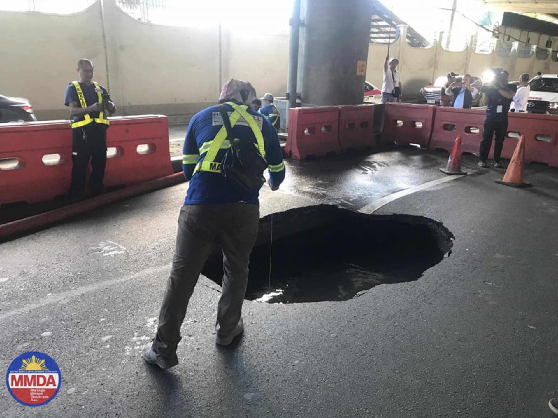 Sinkhole spotted along Sales Road near the Villamor Air Base in Pasay City on Sunday afternoon, April 14, 2024. 