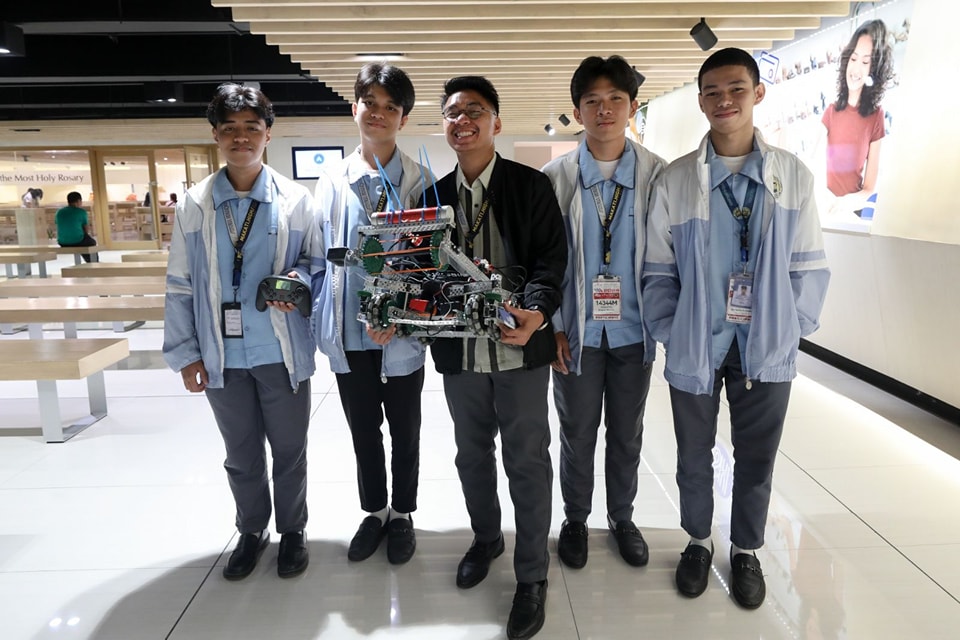 Makati High School's Makatrix Robotics Team, composed of Grade 12 students John Ashley Alvarado, Enriquito Yamzon, Brian Bernabe, and Fritz Rivera, is set to compete in the 2024 VEX Robotics World Championship in Dallas, Texas, from April 25 to May 3. (Photo courtesy of Makati City government Facebook)