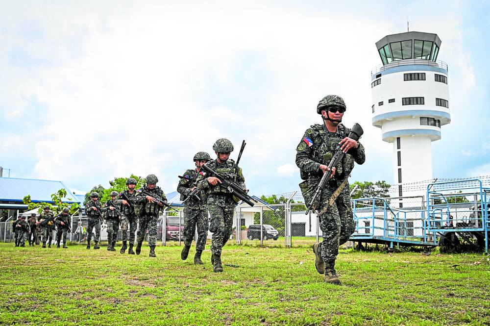 Soldiers conduct an airfield seizure exercise as part of the US-Philippines “Balikatan” joint military exercise at San Vicente Airport in Palawan province on Wednesday —AFP
