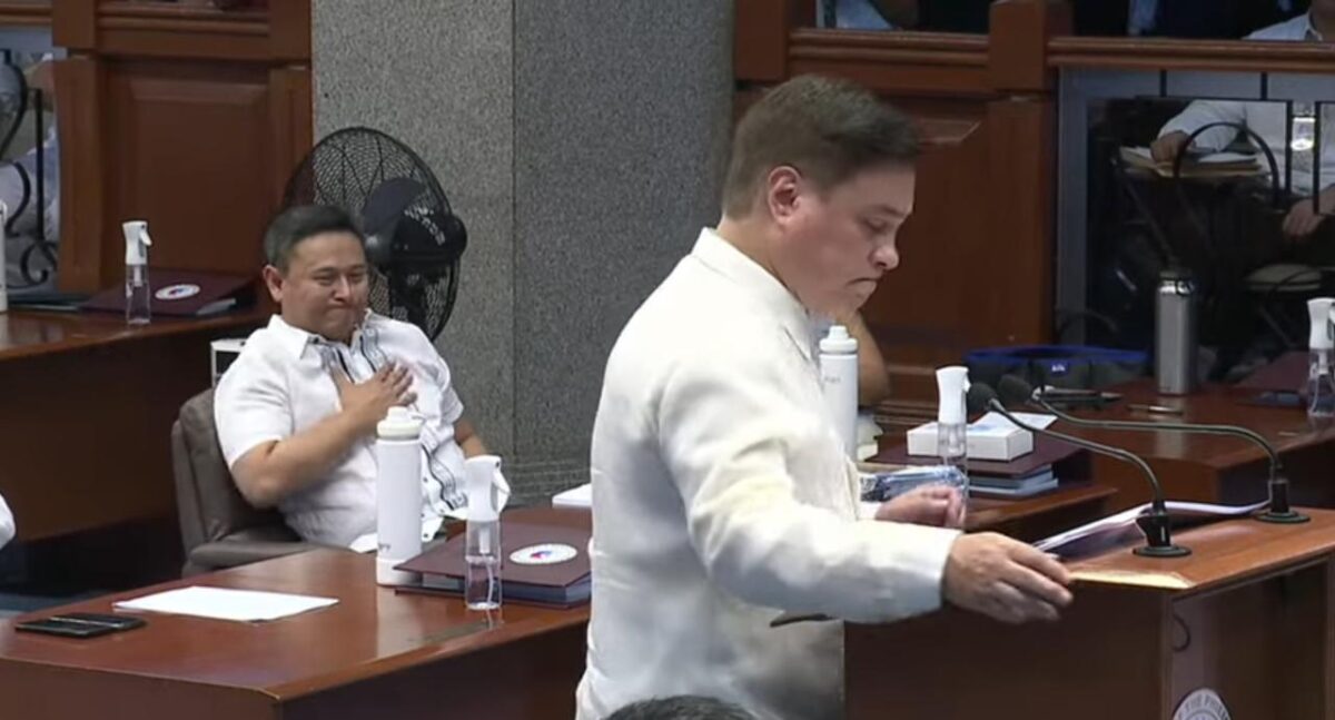 Senator Sonny Angara puts his hand over his heart to express deep bond with Senate President Juan Miguel "Migz" Zubiri, who is thanking his fellow senators for their support throughout his Senate presidency. (May 20, 2024, Screengrab from Senate YouTube channel)