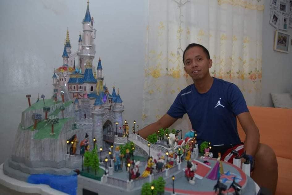 Allan Vincent Cruz shows a paper diorama of Disneyland Paris Castle. Photo courtesy of Allan Papercraft/Facebook